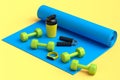 Isometric view of sport equipment like dumbbell, water bottle and yoga mat