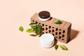 Isometric view of trendy composition made of brick and cosmetic products. Natural beauty products, earthy colors