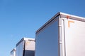 Isotherm cargo semi-trailers on a background of blue sky. The concept of the capacity and volume of a modern semi Royalty Free Stock Photo