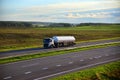 Isothermal Tank truck driving on highway. Oil and Gas Transportation and Logistics.