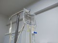 Isotonic solution of 0.9 percent sodium chloride in saline bag. saline solution with clipping path on metal stand.