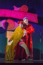 Israel, Beer-Sheva - Two actors on the stage in a yellow and red raincoat 2015