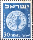 Israel circa 1949: A post stamp printed in Israel showing a coin with a Amphora