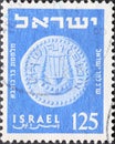 Israel circa 1954: A post stamp printed in Israel showing a coin with a lyre