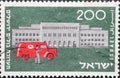 Israel circa 1954: A post stamp printed in Israel showing a Mail Truck and Present G.P.O., Jerusalem