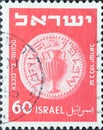 Israel circa 1952: A post stamp printed in Israel showing a coin with an amphora