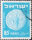 Israel circa 1952: A post stamp printed in Israel showing a coin with Palm Branch and Lemon . light blue