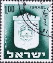 Israel circa 1965: A post stamp printed in Israel showing a Tel Aviv-Yafo coat of arms
