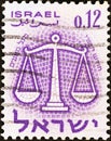 ISRAEL - CIRCA 1961: A stamp printed in Israel from the `Signs of the Zodiac` issue shows the Scales Libra, circa 1961.