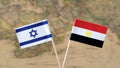 Israel and Egypt flag pins on a world map, political or diplomatic relations concept