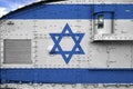 Israel flag depicted on side part of military armored tank closeup. Army forces conceptual background