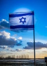 Israel flag waving cloudy sky background sunset