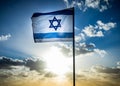 Israel flag waving cloudy sky background sunset