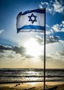 Israel flag waving cloudy sky background sunset