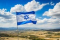 Israel flag waving in the wind on a background of mountains and blue sky Royalty Free Stock Photo