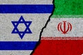 Israel and iran flags painted over cracked wall Royalty Free Stock Photo