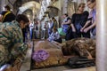 Israel - Jerusalem - Basilica of the Holy Sepulchre - the stone of anointing. The faithful touch the stone to be blessed