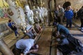 Israel - Jerusalem - Basilica of the Holy Sepulchre - the stone of anointing. The faithful touch the stone to be blessed