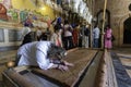 Israel - Jerusalem - Basilica of the Holy Sepulchre - the stone of anointing. The faithful touch the stone to be blessed