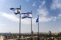 Israel and Jerusalem flags on Jerusalem old city walls against the blue sky with white clouds in  Sunny summer light Royalty Free Stock Photo