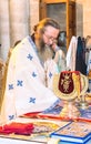 Israel / Jerusalem - 03/26/2016: An Orthodox priest celebrates the Liturgy in the Church of the Holy Sepulcher. Resurrection of