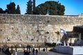 Israel, Jerusalem, Western Wall with prayer Flag of Israel and blurred silhouettes of people. Jerusalem Western Wall Royalty Free Stock Photo