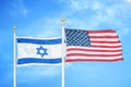 Israel and United States two flags on flagpoles and blue cloudy sky Royalty Free Stock Photo