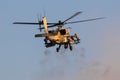 Israeli Air Force AH-64 Apache combat helicopter firing guns during an airshow at Hatzerim, Israel