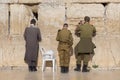 Israeli army IDF soldiers praying for peace at Western Wall in Jerusalem Old City during war with Hamas in Gaza that led