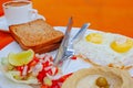 Israeli breakfast with eggs , hummus and salad Royalty Free Stock Photo