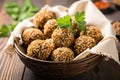 israeli falafel balls with sesame seeds in a basket