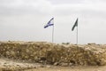 Israeli Flag aloft atTel Megiddo archaeological site Israel Royalty Free Stock Photo