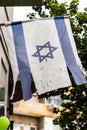 Israeli flag hanging on a building door in Tel Aviv, Israel Royalty Free Stock Photo