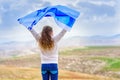 Israeli jewish little girl with Israel flag back view.