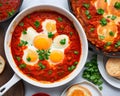 Israeli and Middle eastern traditional Shakshouka dish served on table. AI generated Royalty Free Stock Photo