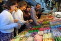 Israeli people buying candy confections in Machaneh Yehudah Market Jerusalem Israel