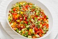 Israeli salad of finely diced veggies in bowl