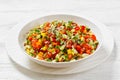 Israeli salad of finely diced veggies in bowl