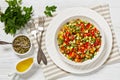 Israeli salad of finely diced veggies in bowl