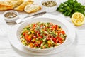 Israeli salad of finely diced veggies in bowl