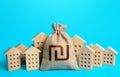 Israeli shekel money bag among town houses figurines. Rich city. Rental business. Realtor services. Sale of real estate. property Royalty Free Stock Photo