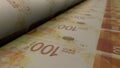 Israeli 100 shekels bills on money printing machine. Banknotes.