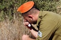 Israeli soldier mourns and cries for the fallen soldiers of Israel on the Yom HaZikaron - Israel Memorial Day Royalty Free Stock Photo