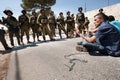 Israeli soldiers and Palestinian protest