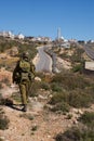 Israeli soldiers patrol in palestinian village