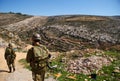 Israeli soldiers patrol in palestinian village