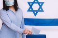 Israeli woman votes at a polling station on election day.