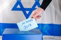 Israeli woman votes at a polling station on election day.Close up of hand. Royalty Free Stock Photo