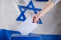 Israeli woman votes at a polling station on election day.