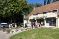 Customers queuing to withdraw cash from a cashpoint at a branch of the bank Credit Agricole